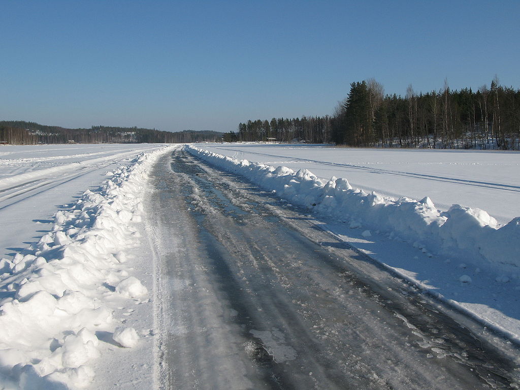 icy road with snow all around