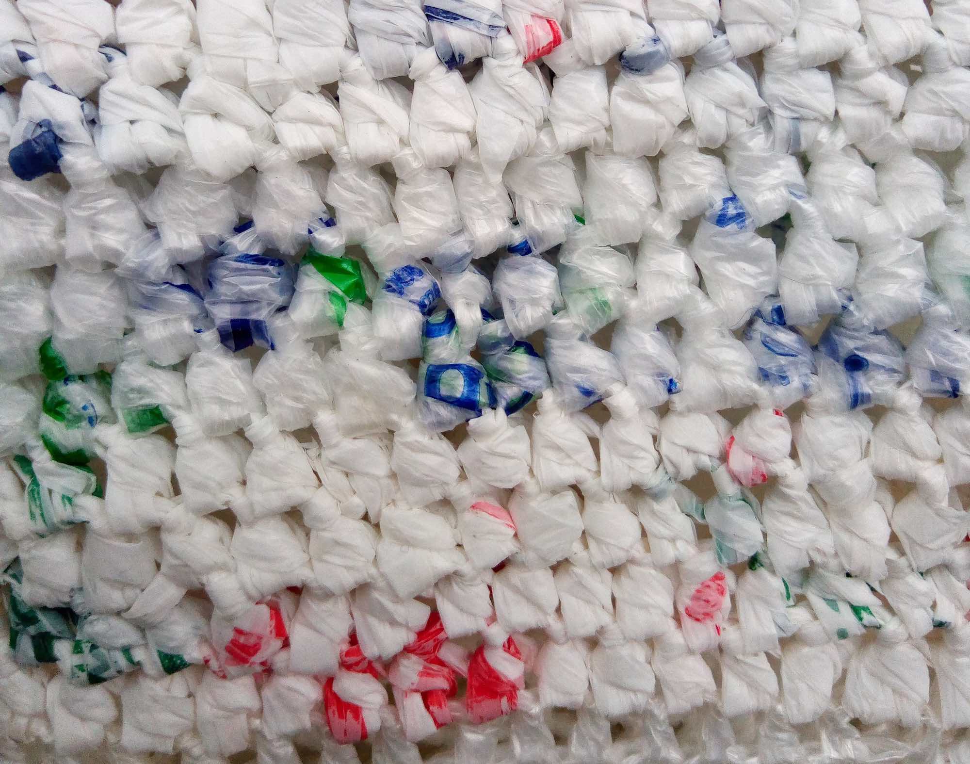 A glove made of "plarn", "plastic yarn", yarn made from plastic bags