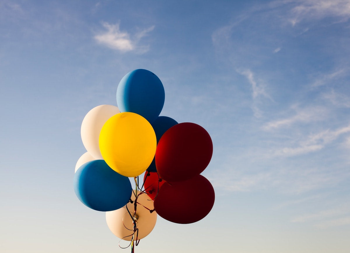 a bunch of balloons grouped together