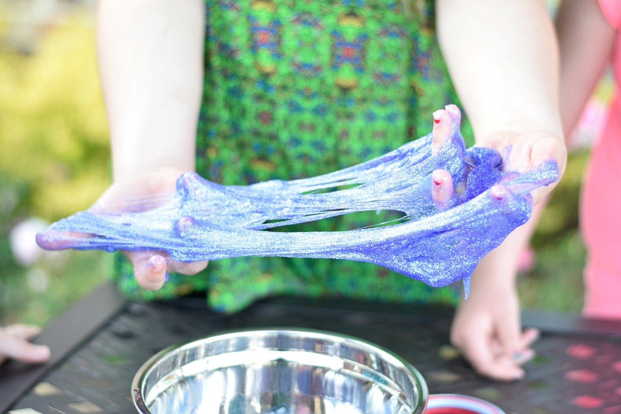 stretching out slime over a bowl