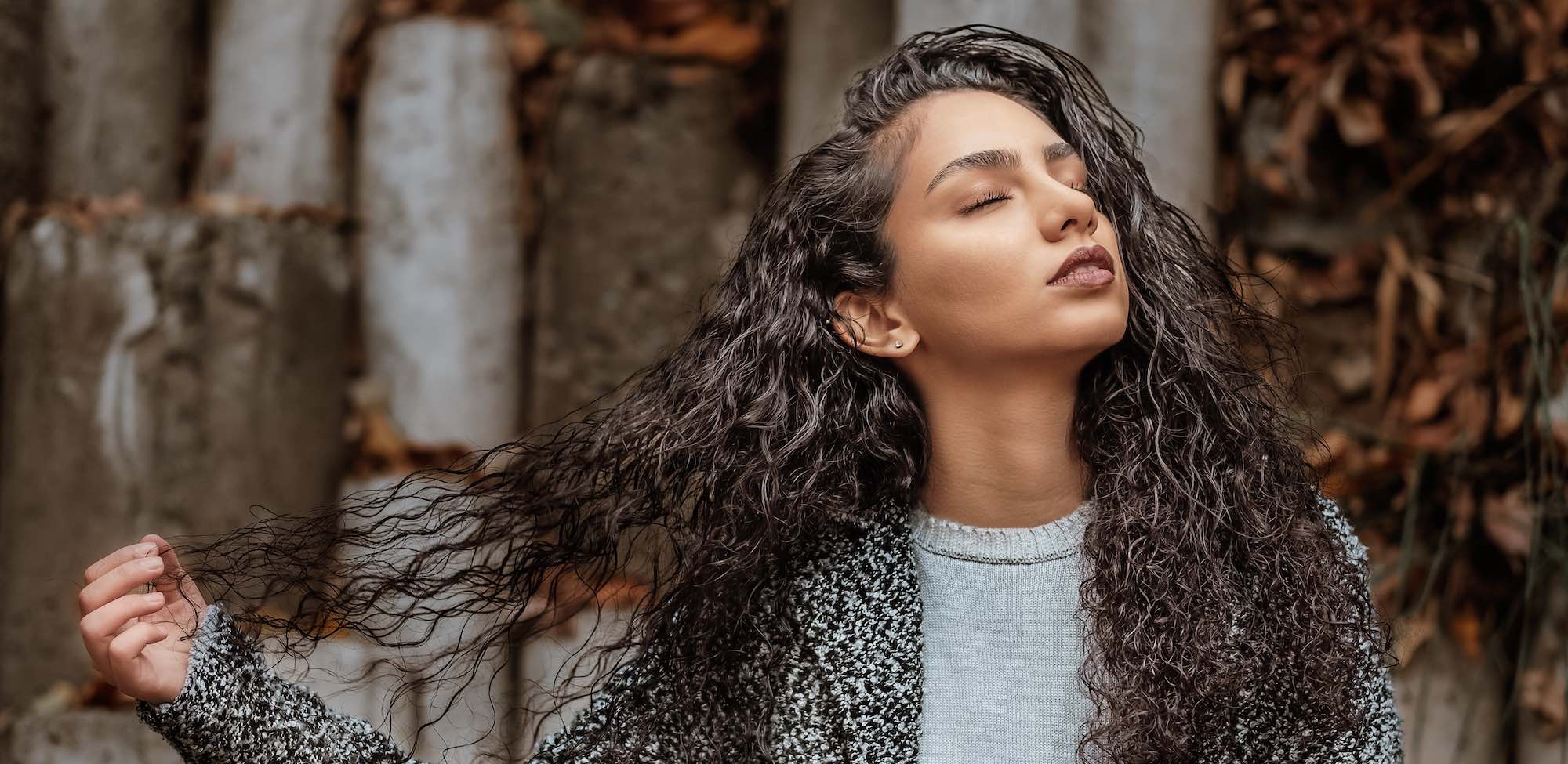 woman holding her hair