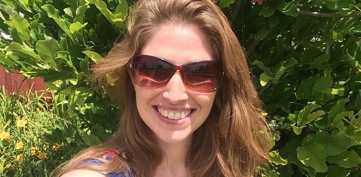 woman with sunglasses on smiling