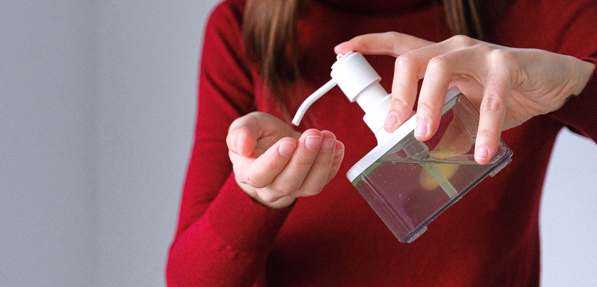 Woman Applying Hand Sanitizer