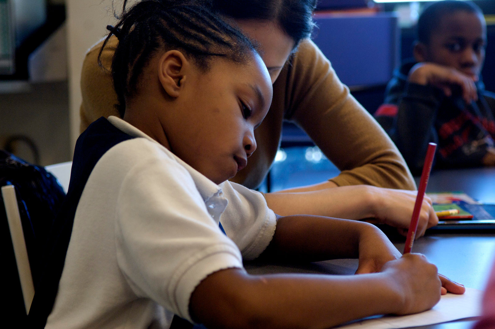 kid in school writing