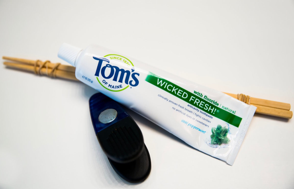Toms toothpaste with chopsticks and a chip clip