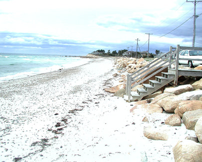 a small set of stairs leading down to the beach
