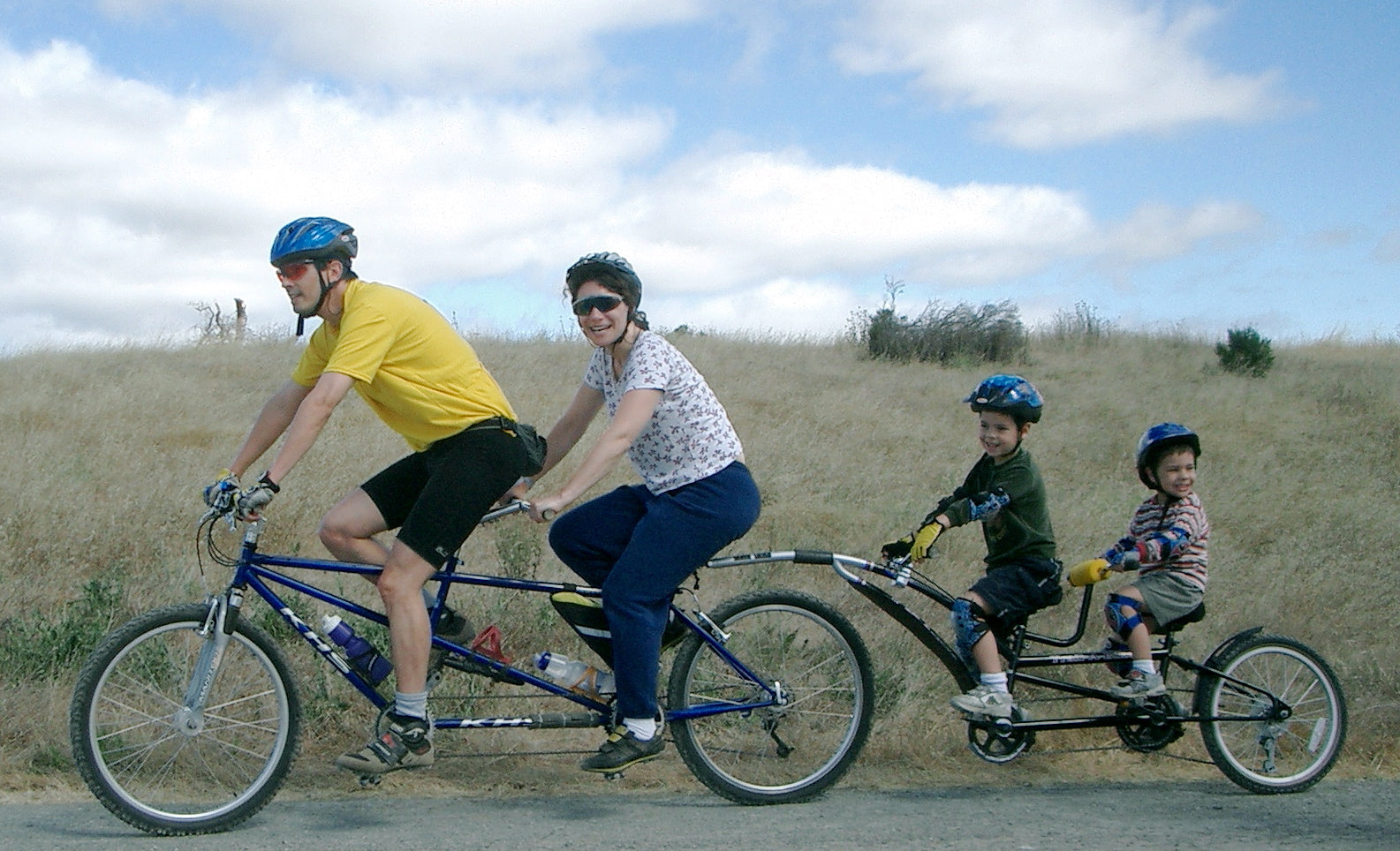 family riding a tandem bike