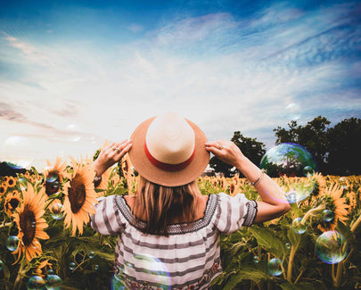 Standing Woman Surrounded of Sunflowers