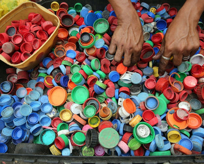 Person Hands on Assorted-color Plastic Lid Lot