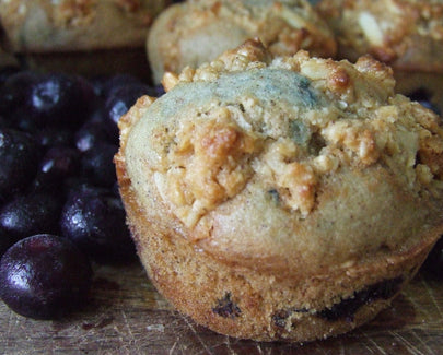 blueberry muffin next to blueberries