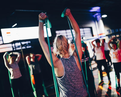 group of people in gym while exercising