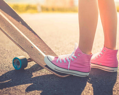 Girl with Pink Shoes Ready to Longboard Ride