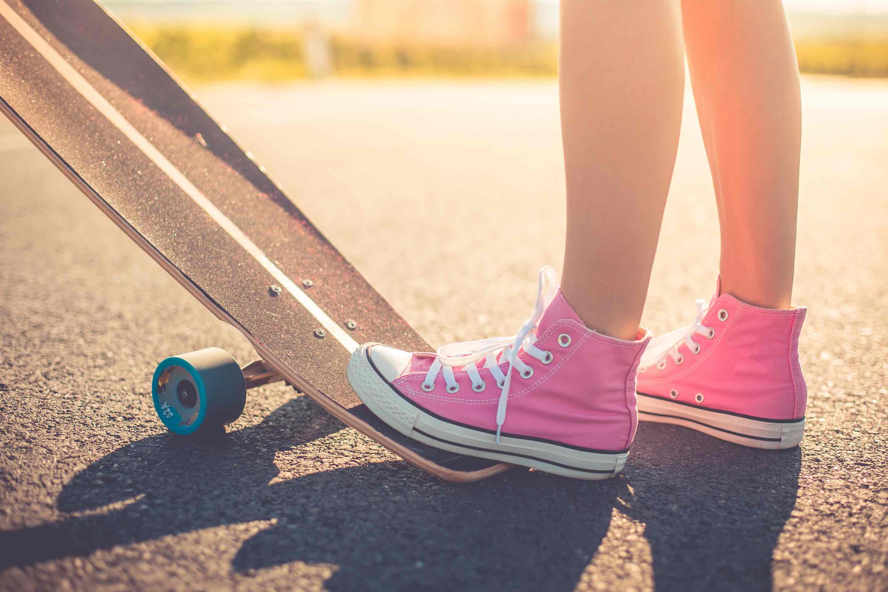 Girl with Pink Shoes Ready to Longboard Ride