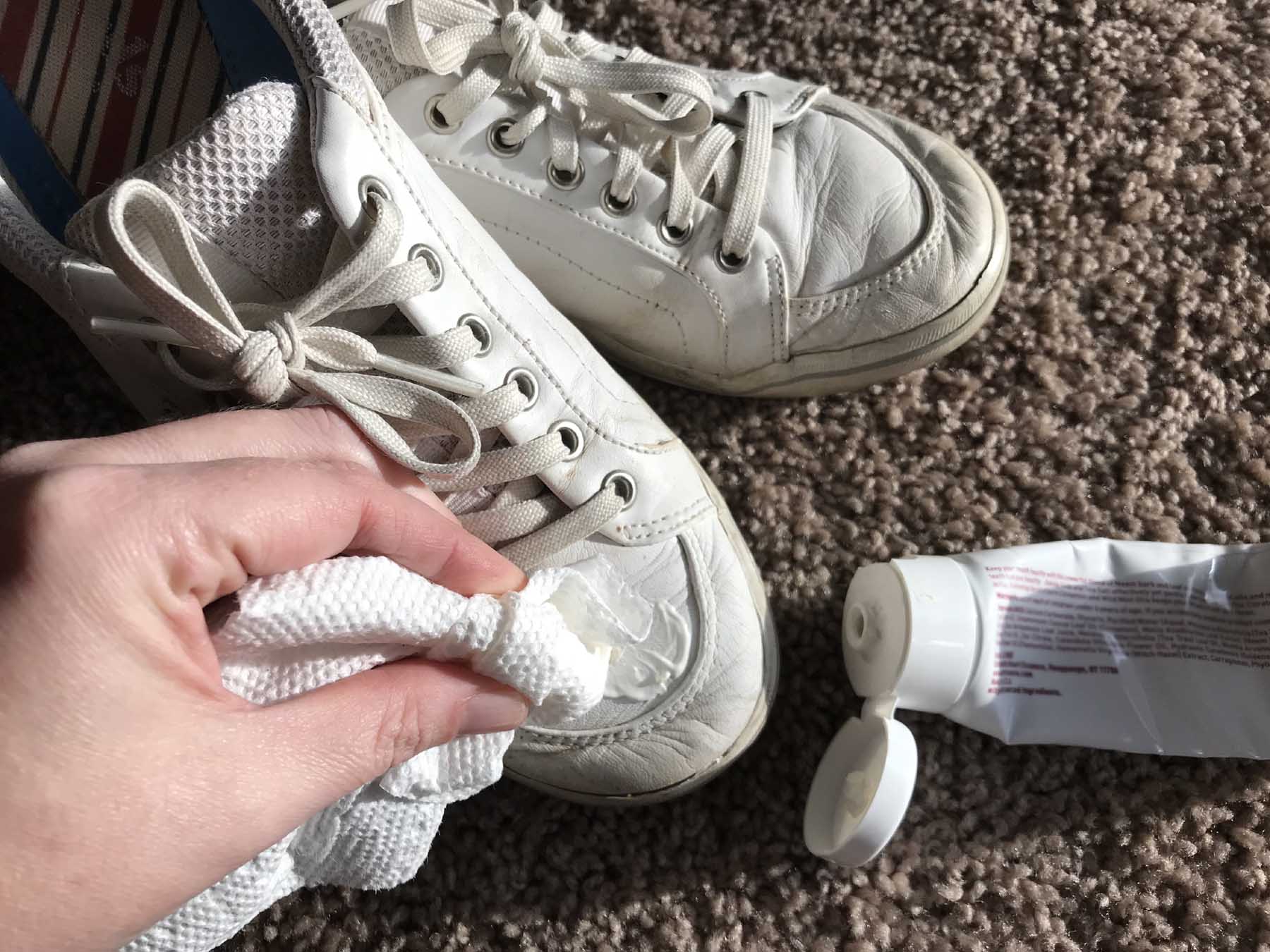 using toothpaste to clean white sneakers