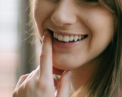 woman in pink tank top smiling
