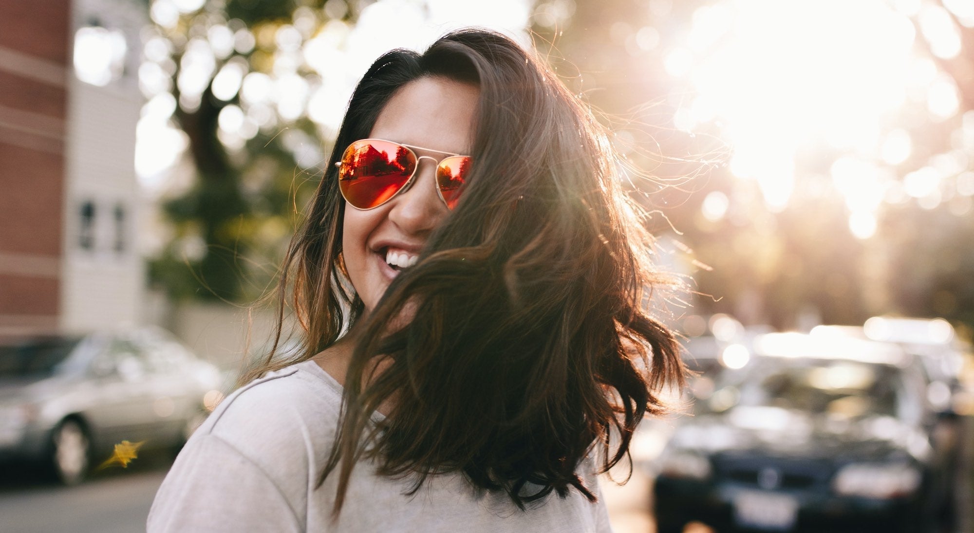 Woman wearing sunglasses smiling