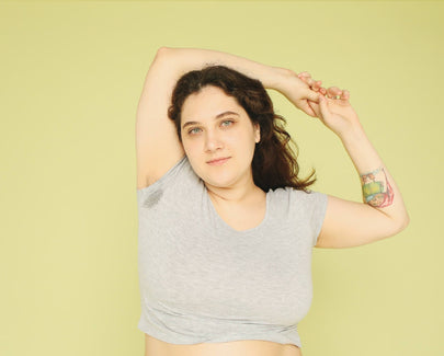 a woman showing her arms up