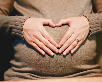 person holding belly photo