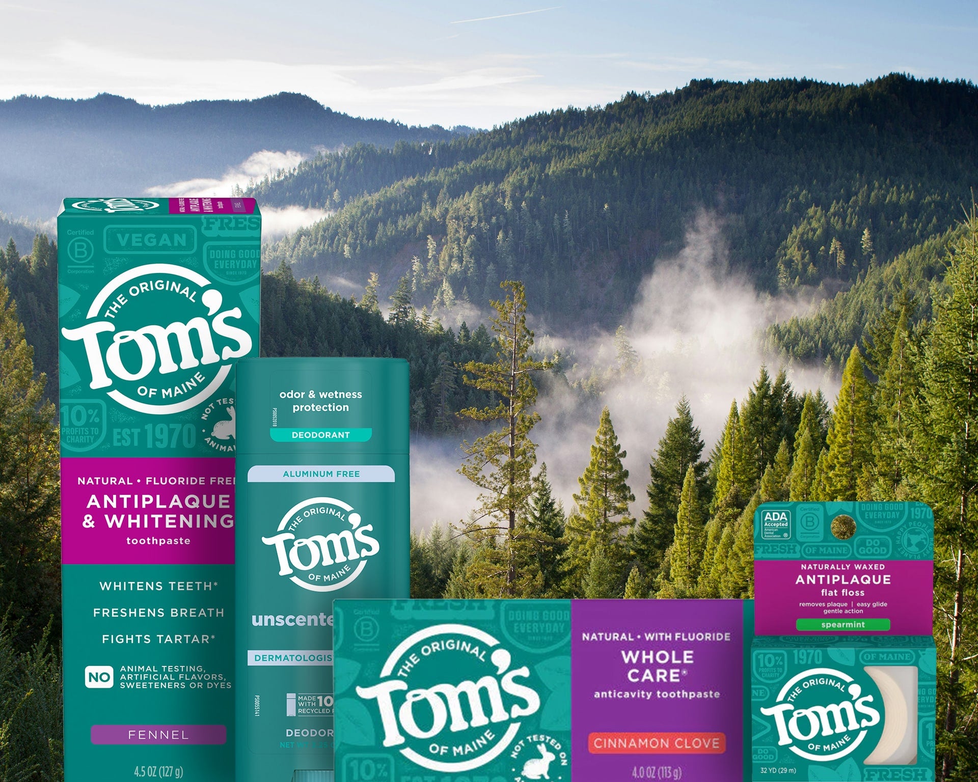 Tom's of Maine toothpaste boxes with a scenic mountain background